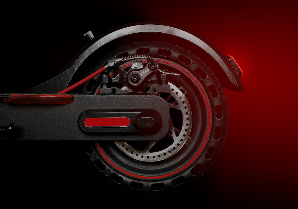 Disc brakes operate by a mechanical calliper gripping a spinning metal rotor attached to the wheel.